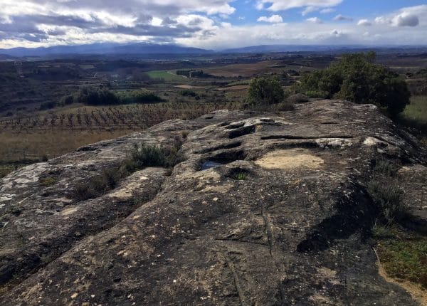 An ancient stone lagar along the way